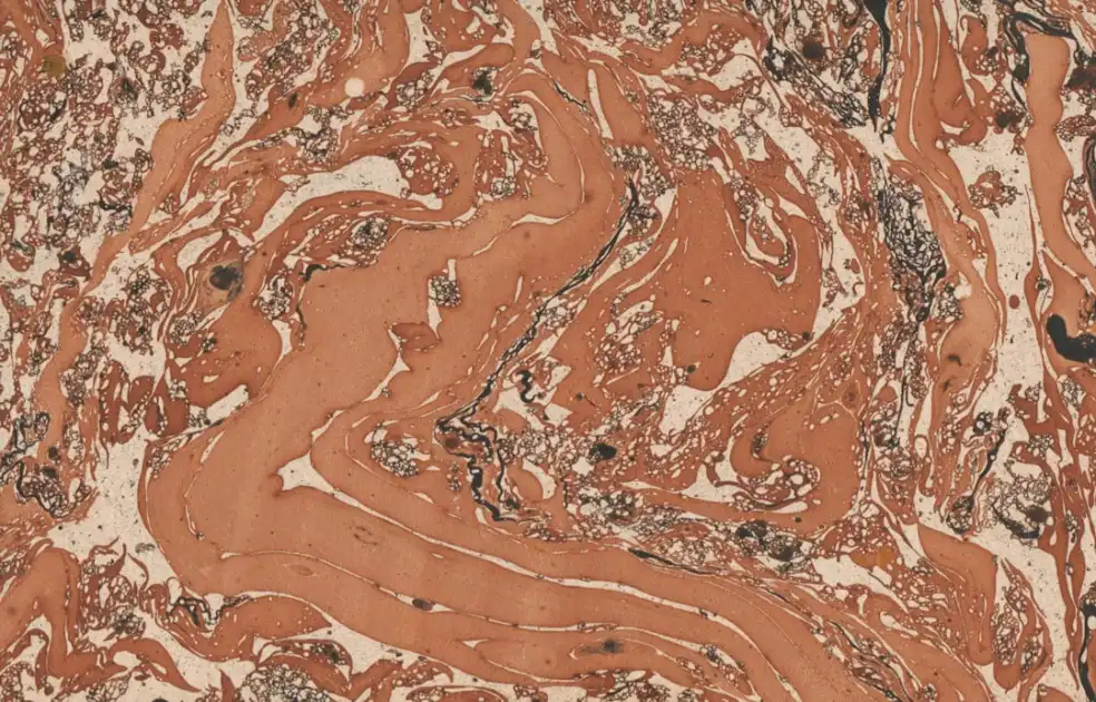 Abstract marbled pattern with orange, white, and black swirls